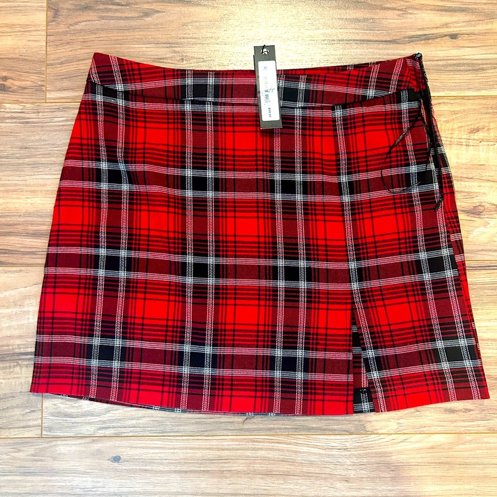 NWT bought off revolve. Mini skirt with small slit.